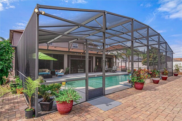 4604 Barbados Loop, Clermont, FL 34711 - view of swimming pool featuring a patio, glass enclosure, and an outdoor living space