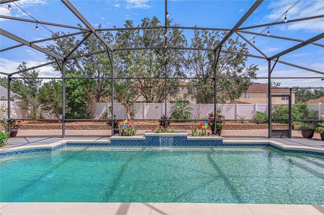 4604 Barbados Loop, Clermont, FL 34711 - view of pool featuring fence, glass enclosure, and a patio