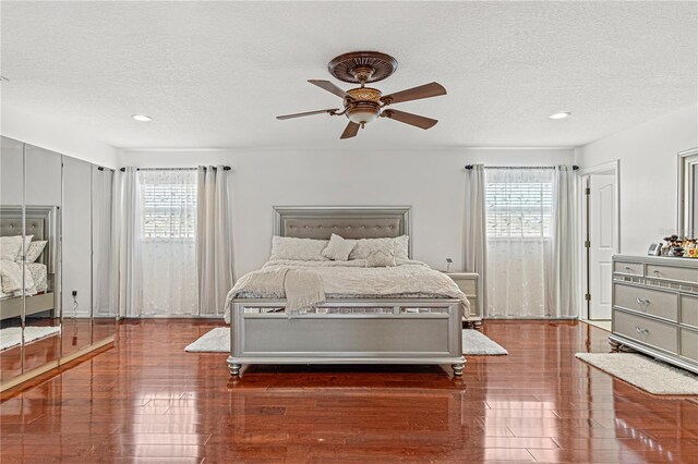 4604 Barbados Loop, Clermont, FL 34711 - bedroom with multiple windows, a textured ceiling, recessed lighting, and a ceiling fan