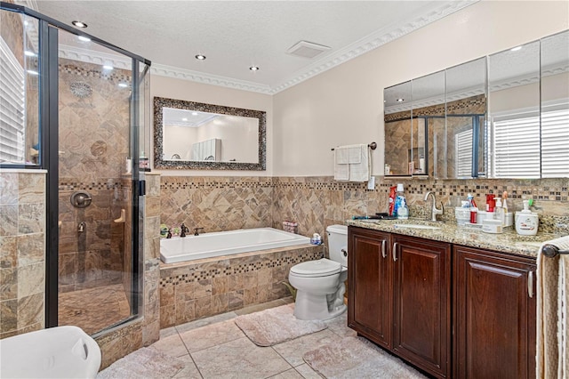 4604 Barbados Loop, Clermont, FL 34711 - full bathroom with a garden tub, tile walls, a shower stall, toilet, and crown molding