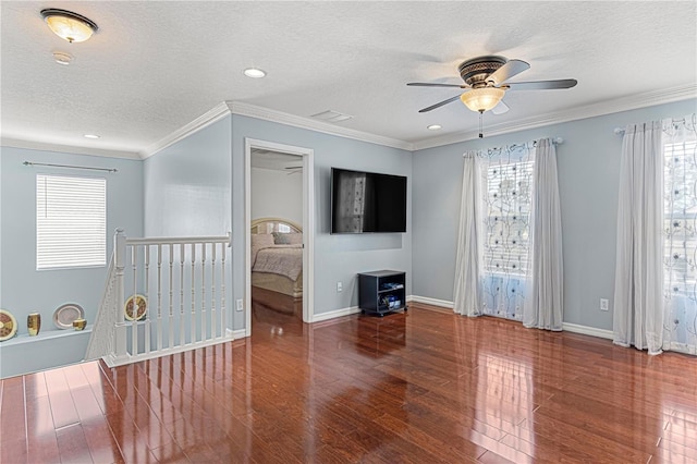 4604 Barbados Loop, Clermont, FL 34711 - unfurnished room with wood finished floors, ceiling fan, a textured ceiling, healthy amount of natural light, and baseboards