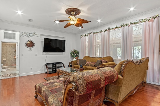 4604 Barbados Loop, Clermont, FL 34711 - living area featuring a ceiling fan, wood finished floors, ornamental molding, and baseboards