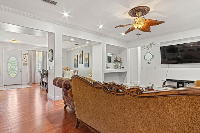4604 Barbados Loop, Clermont, FL 34711 - living room with ceiling fan, wood finished floors, and crown molding