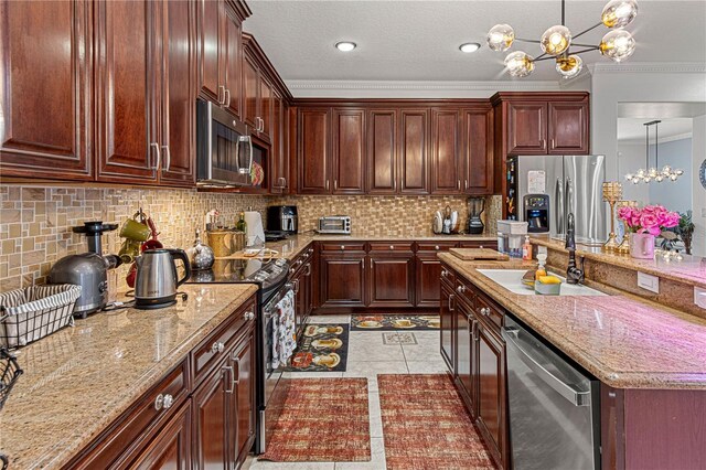 4604 Barbados Loop, Clermont, FL 34711 - kitchen with appliances with stainless steel finishes, a sink, a chandelier, ornamental molding, and pendant lighting