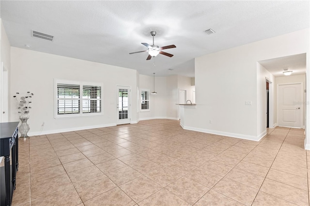 703 Elkhorn Fern Ln, Deland, FL 32720 - unfurnished living room featuring ceiling fan, light tile patterned flooring, and baseboards