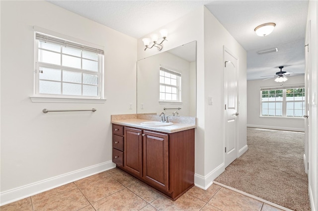703 Elkhorn Fern Ln, Deland, FL 32720 - bathroom with baseboards, vanity, ceiling fan, and tile patterned flooring