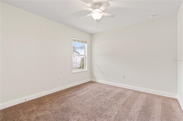 703 Elkhorn Fern Ln, Deland, FL 32720 - unfurnished room with light colored carpet, baseboards, and a ceiling fan