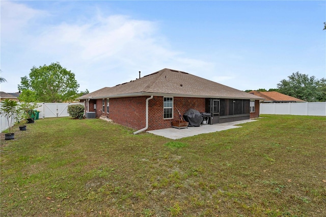 703 Elkhorn Fern Ln, Deland, FL 32720 - back of house with a patio area, brick siding, a sunroom, a gate, and cooling unit