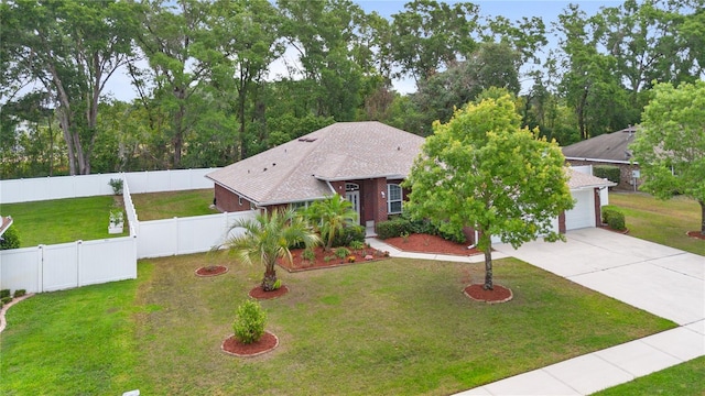703 Elkhorn Fern Ln, Deland, FL 32720 - view of front of house with driveway and an attached garage