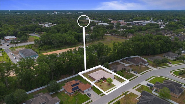 703 Elkhorn Fern Ln, Deland, FL 32720 - view of property location with property parcel outlined, a heavily wooded area, and nearby suburban area