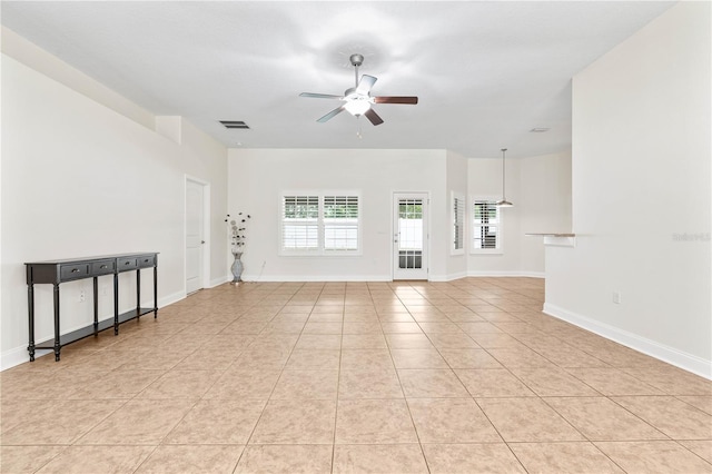 703 Elkhorn Fern Ln, Deland, FL 32720 - unfurnished room featuring a ceiling fan, light tile patterned flooring, and baseboards