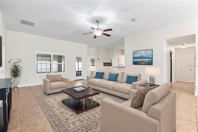 703 Elkhorn Fern Ln, Deland, FL 32720 - living area with light tile patterned floors, a ceiling fan, and baseboards