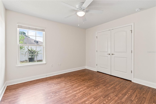 703 Elkhorn Fern Ln, Deland, FL 32720 - empty room with wood finished floors, baseboards, a smoke detector, and ceiling fan