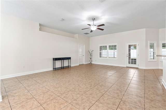 703 Elkhorn Fern Ln, Deland, FL 32720 - empty room featuring ceiling fan, light tile patterned flooring, and baseboards