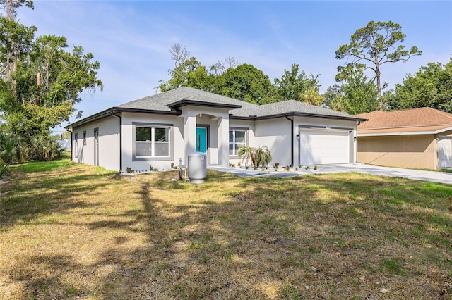 1738 Palm Rd, Ormond Beach, FL 32174 - view of front of house featuring an attached garage, stucco siding, a front yard, and concrete driveway