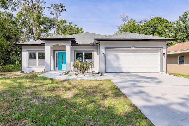 1738 Palm Rd, Ormond Beach, FL 32174 - view of front of property featuring an attached garage, concrete driveway, stucco siding, a front yard, and roof with shingles