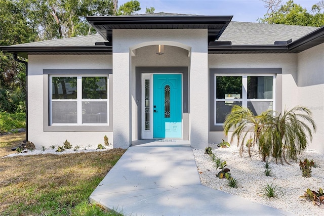 1738 Palm Rd, Ormond Beach, FL 32174 - entrance to property with stucco siding and a shingled roof
