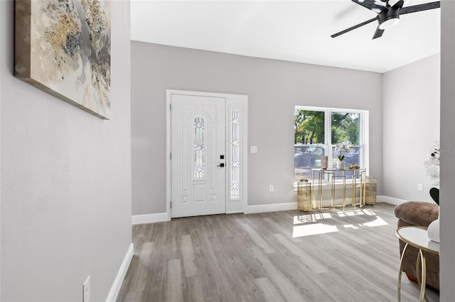 1738 Palm Rd, Ormond Beach, FL 32174 - entrance foyer featuring wood finished floors, a ceiling fan, and baseboards