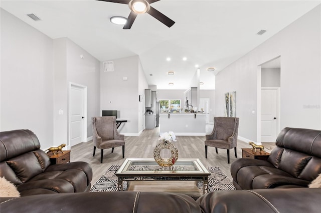 1738 Palm Rd, Ormond Beach, FL 32174 - living room with ceiling fan, light wood-type flooring, baseboards, and lofted ceiling