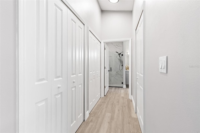 1738 Palm Rd, Ormond Beach, FL 32174 - corridor with light wood-style flooring and baseboards