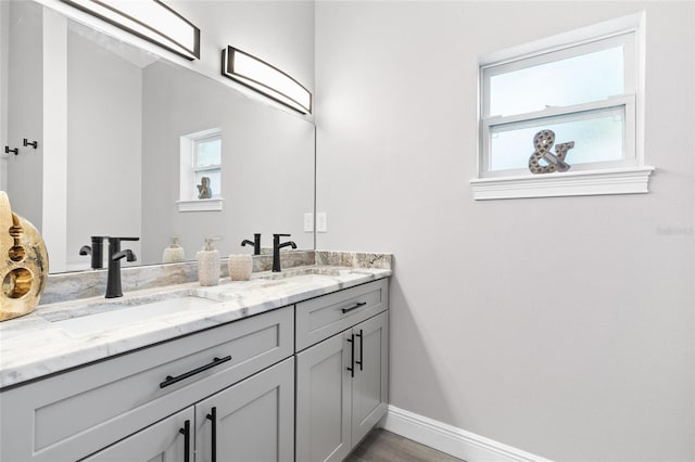 1738 Palm Rd, Ormond Beach, FL 32174 - bathroom featuring plenty of natural light, double vanity, and baseboards