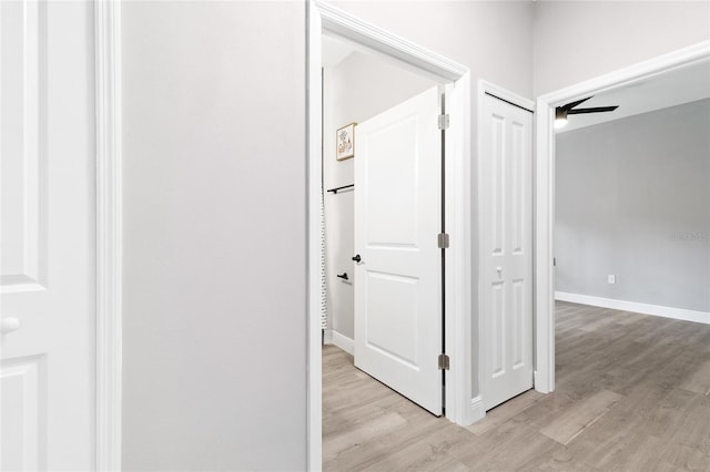 1738 Palm Rd, Ormond Beach, FL 32174 - hallway featuring light wood-type flooring and baseboards