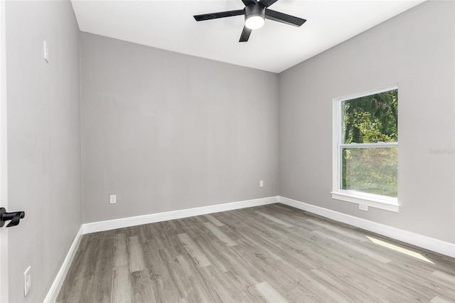 1738 Palm Rd, Ormond Beach, FL 32174 - spare room with wood finished floors, a ceiling fan, and baseboards
