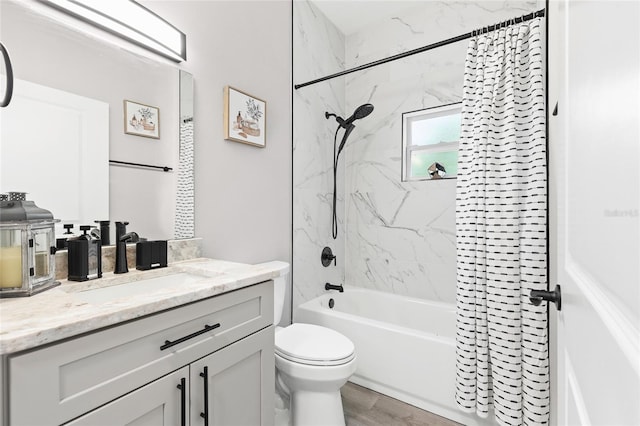 1738 Palm Rd, Ormond Beach, FL 32174 - bathroom featuring  shower combination, toilet, vanity, and wood finished floors
