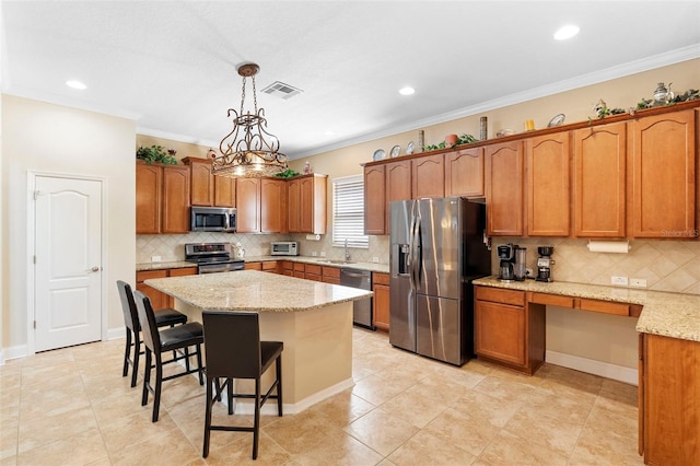 123 Ivydale Manor Dr, Deland, FL 32724 - kitchen with appliances with stainless steel finishes, a sink, a breakfast bar area, tasteful backsplash, and brown cabinets
