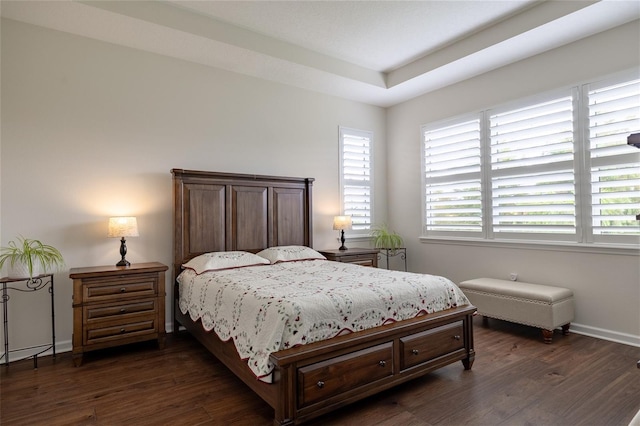 bedroom featuring dark wood-type flooring and baseboards