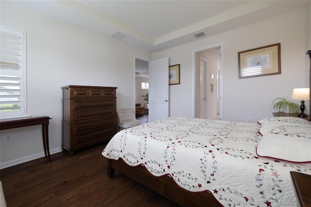 bedroom with dark wood-style floors and baseboards