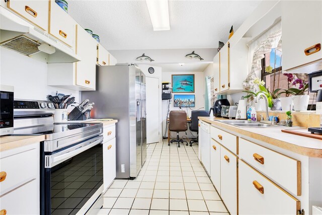 418 Falcon Ave, Edgewater, FL 32141 - kitchen with stainless steel electric range, a sink, under cabinet range hood, light countertops, and light tile patterned floors