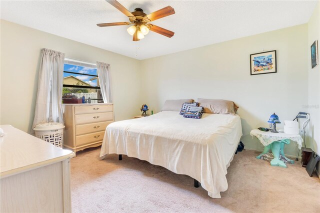 418 Falcon Ave, Edgewater, FL 32141 - bedroom with light colored carpet and a ceiling fan