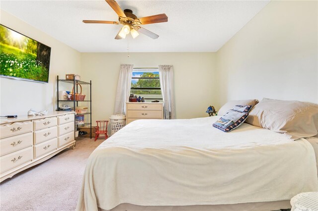 418 Falcon Ave, Edgewater, FL 32141 - bedroom with light colored carpet and ceiling fan