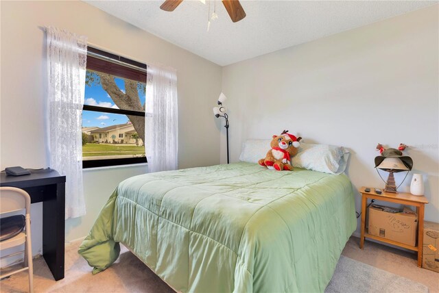 418 Falcon Ave, Edgewater, FL 32141 - bedroom with carpet flooring and a ceiling fan