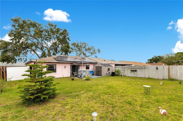 418 Falcon Ave, Edgewater, FL 32141 - view of yard with a storage unit and an outbuilding