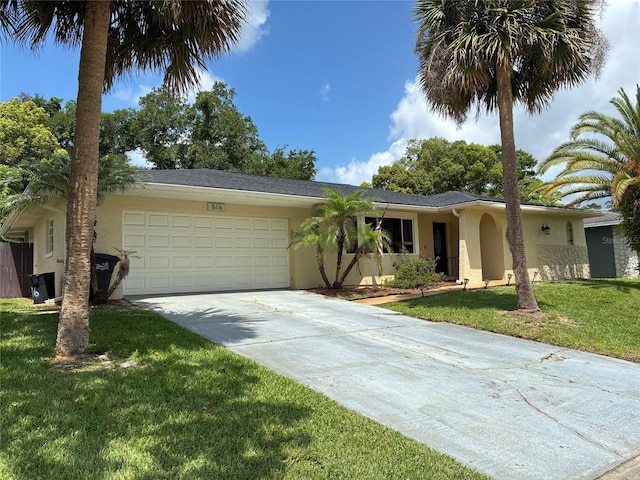 516 Hickorywood Ave, Altamonte Springs, FL 32714 - ranch-style home featuring stucco siding, an attached garage, driveway, and a front yard