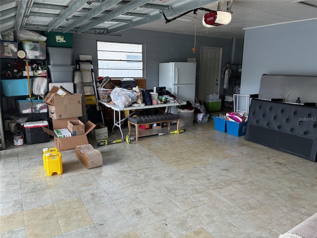 516 Hickorywood Ave, Altamonte Springs, FL 32714 - garage with freestanding refrigerator and a garage door opener