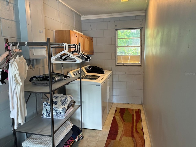 516 Hickorywood Ave, Altamonte Springs, FL 32714 - laundry area with washing machine and dryer, cabinet space, and concrete block wall