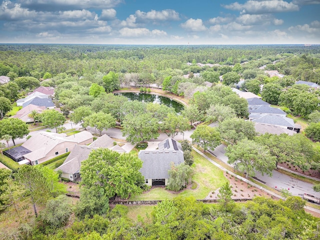 aerial view of residential area featuring a heavily wooded area
