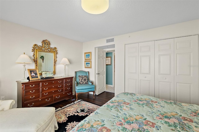 2967 S Atlantic Ave Unit 202, Daytona Beach Shores, FL 32118 - bedroom featuring a closet and wood finished floors