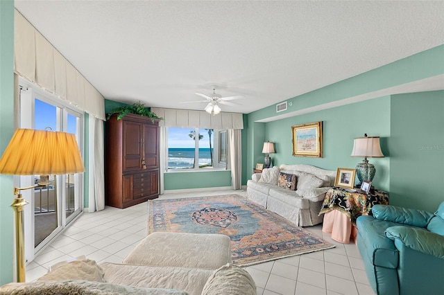 2967 S Atlantic Ave Unit 202, Daytona Beach Shores, FL 32118 - living room with light tile patterned flooring and a ceiling fan