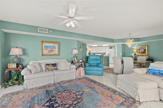 2967 S Atlantic Ave Unit 202, Daytona Beach Shores, FL 32118 - living area featuring light tile patterned flooring, ceiling fan, and a chandelier