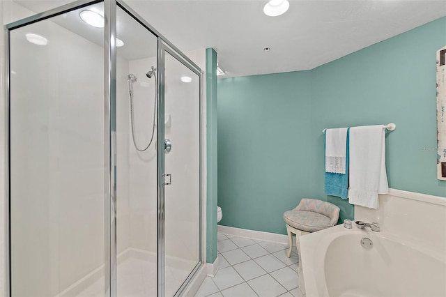 2967 S Atlantic Ave Unit 202, Daytona Beach Shores, FL 32118 - full bath featuring tile patterned floors, a stall shower, a bath, and toilet