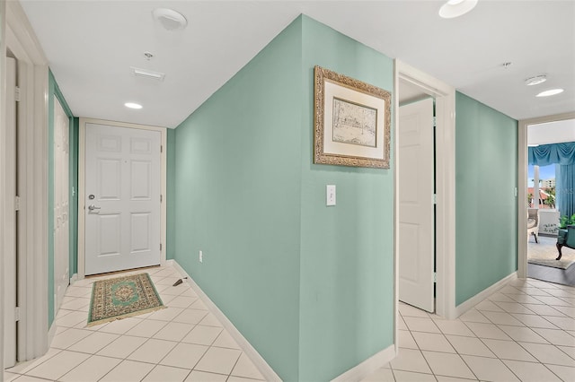 2967 S Atlantic Ave Unit 202, Daytona Beach Shores, FL 32118 - hallway with light tile patterned floors and baseboards