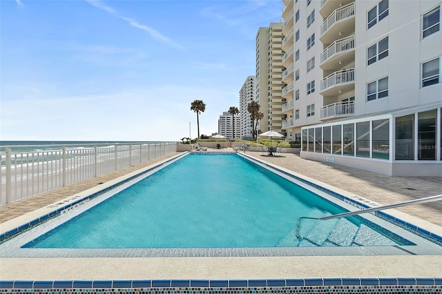 2967 S Atlantic Ave Unit 202, Daytona Beach Shores, FL 32118 - community pool with fence and a patio area
