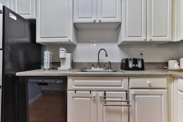 2800 N Atlantic Ave Unit 206, Daytona Beach, FL 32118 - kitchen with black appliances, a sink, decorative backsplash, and white cabinets