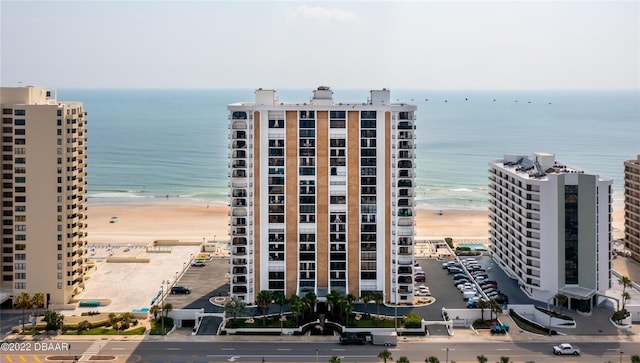 view of property featuring view of water and beach