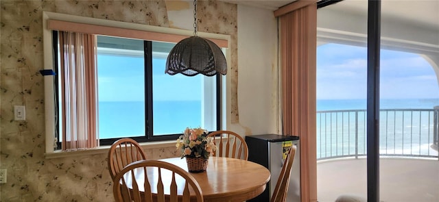 dining area featuring a water view