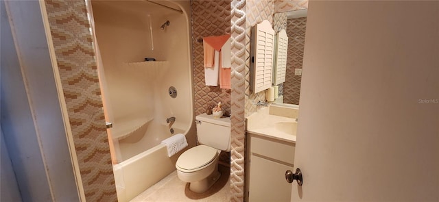 full bathroom featuring toilet, vanity, and tub / shower combination